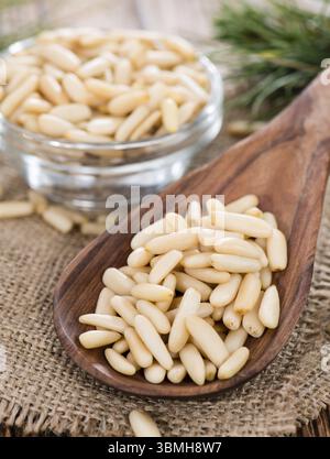 Some fresh Pine Nuts on dark vintage wooden background Stock Photo