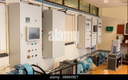 Wall-mounted control cabinet is powering electric motors in flat design equipment room with windows Stock Photo