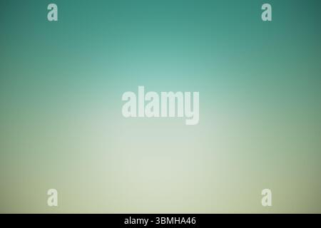 Flat design gradient background is transitioning smoothly from teal to beige with vignette effect Stock Photo