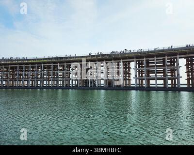 Osaka-Kansai Expo 2025 Water Plaza & The Grand Ring Timber Walkway over the Lagoon Stock Photo