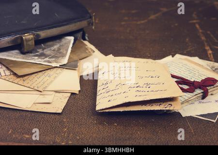 Postal letters in the vintage black handbag Stock Photo