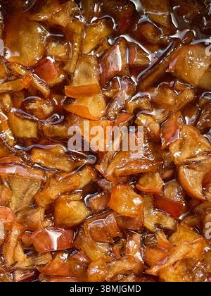 Apple cinnamon jam, traditional jam, red apples with cinnamon. Stock Photo