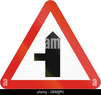 Side road intersection warning sign Stock Photo - Alamy