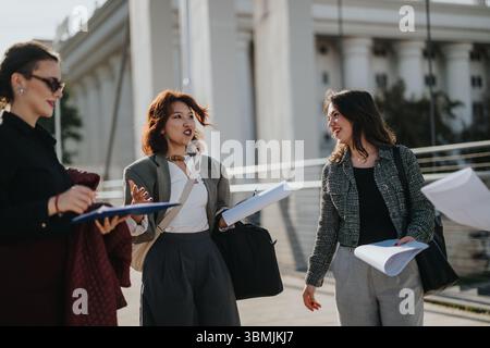 Multicultural business team discussing ideas and analyzing growth trends Stock Photo
