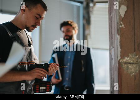 Professional Workers Collaborating on a Construction Project Within a Renovated Space Stock Photo