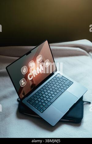 Open laptop with CRM Customer Relationship Management concept on screen. Customer management. Stock Photo