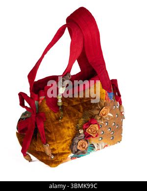 Traditional Japanese style highly decorative handmade ladies quitted fabric handbag as cutout on white Stock Photo