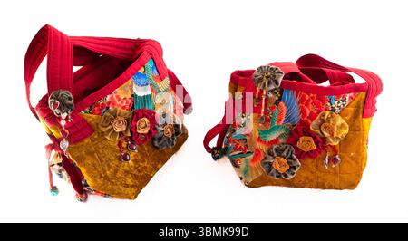 Traditional Japanese style highly decorative handmade ladies quitted fabric handbag as cutout on white Stock Photo