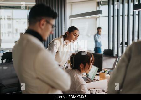 Group of business coworkers collaborating in a modern office environment Stock Photo