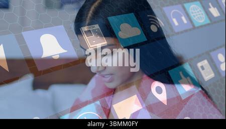 Using image, woman interacting with digital interface and app icons floating Stock Photo