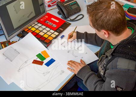 Netherlands, an industrial designer or product designer works on both the design and the color of a new chair. Stock Photo