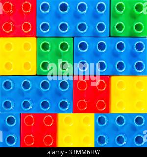 Seamless 4k photo texture material of multi colored plastic construction blocks toy surface. Construction blocks pattern. Stock Photo