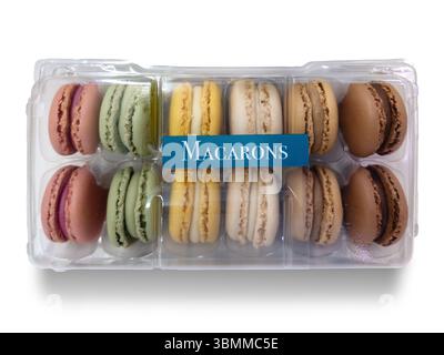 Macarons in clear plastic box isolated on white with clipping path included, typical French dessert Stock Photo