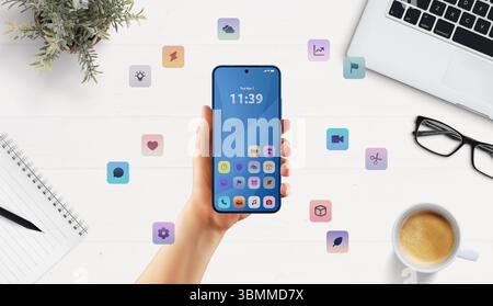 Clean smartphone mockup in modern office setup with floating apps suggests versatile business or developer UI tools Stock Photo
