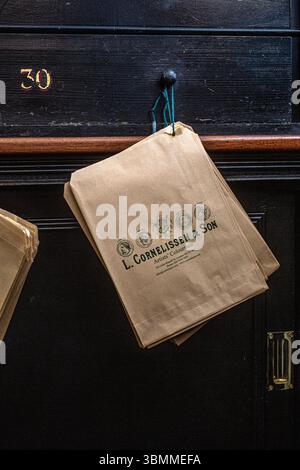 Brown strung paper counter bags at  L Cornelissen & Son the legendary London art supplies shop . Stock Photo