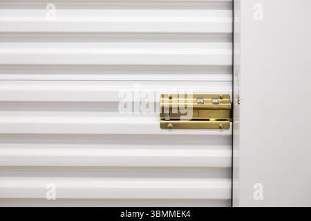 slide latch on storage unit door Stock Photo