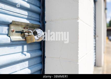 Key lock securing door on self storage unit. Stock Photo