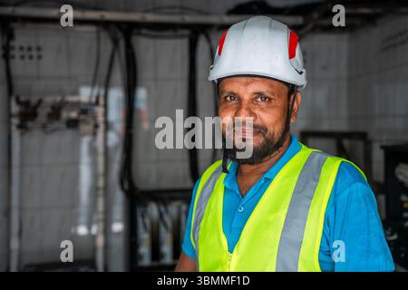 Technician and engineer team fixing network devices, routers, configuring servers, and repairing cables in network room. IT maintenance Stock Photo