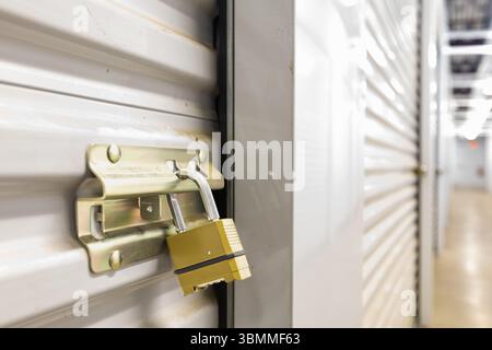 Combination lock on white self storage door Stock Photo