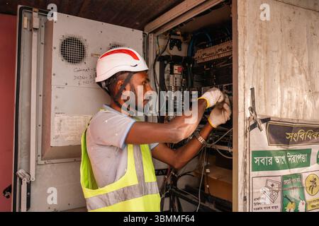 Technician and engineer team fixing network devices, routers, configuring servers, and repairing cables in network room. IT maintenance Stock Photo