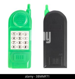 Isolated photo of green colored plastic kids toy cellphone on white background. Stock Photo