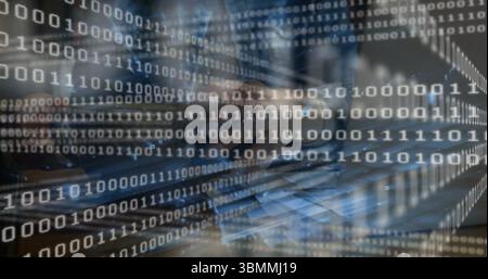 Woman's hands typing code on laptop keyboard at desk, with long sleeve shirt and binary overlay Stock Photo