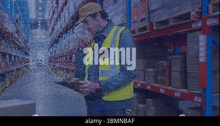 Inspecting warehouse worker checking inventory in warehouse aisle with tablet and boxes, copy space Stock Photo