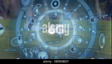 Showing futuristic 6G interface over grass field with concentric rings, globe icons and sports ball Stock Photo