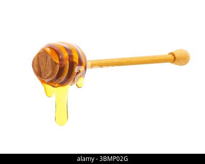 Thick honey dripping from the honey spoon, two drop, isolated on white background. Stock Photo
