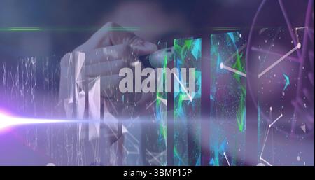 Hand holding stylus pen manipulating network nodes on panels in workspace, holographic beams Stock Photo