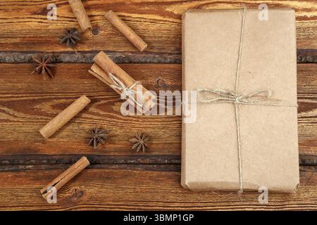 Gift Packed in eco-friendly biodegradable cardboard on dark old wooden background with blank space for text. top view. flat lay Stock Photo