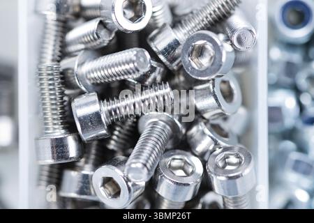 Different Screws and other Parts sorted in a box (close-up shot) Stock Photo