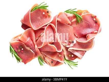 Jamon or Prosciutto,  Dry Cured Meat or Ham slice, with rosemary and pepper isolated on white background. Stock Photo