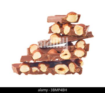 Chunks of  milk chocolate with nuts isolated on white background. Stock Photo