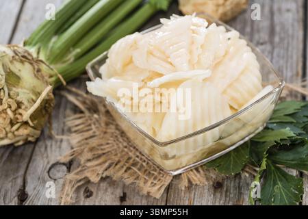 Portion of Celeriac Salad (close-up shot) on wooden background Stock Photo