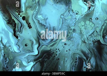Fluid Art. Green and blue abstract wave swirls on black background. Marble effect background or texture Stock Photo