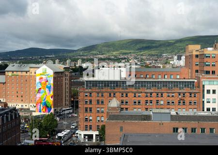 Belfast city centre skyline and rooftops looking west past the Holiday Inn hotel towards the Black Hill and Black Mountain, Northern Ireland Stock Photo