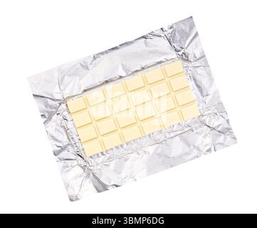 white chocolate bar in silver foil packaging top view isolated on a white background. Whole slab of white chocolate isolated on white background Stock Photo