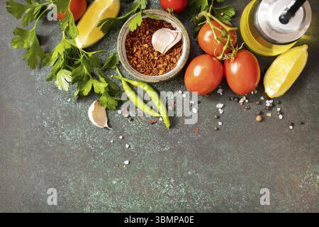 Healthy food vegetarian food background. Various herbs and spices for cooking on dark background. View from above. Copy space Stock Photo