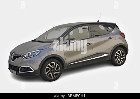 Modern metallic gray Renault Captur from a three-quarter view, isolated on white, ready to hit the road Stock Photo