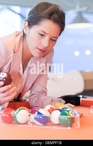 woman arranging the billiard balls Stock Photo