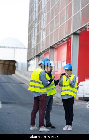 workers talking in shipping yard Stock Photo