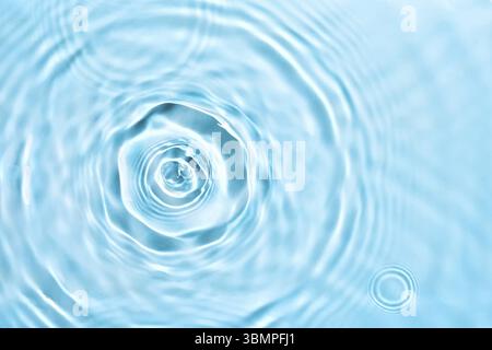 Cosmetic moisturizer micellar water. Abstract transparent liquid background with concentric circles. Soft focus Stock Photo