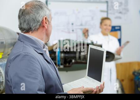 engineer with laptop in design workshop Stock Photo