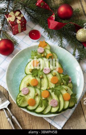 New year meal idea Christmas tree from a salad olivier on a rustic table. Christmas creative appetizer salad like a christmas tree with festive decora Stock Photo