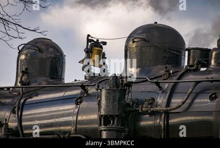 A Close Up View of an Antique Steam Engines Bell and Compressor Stock Photo