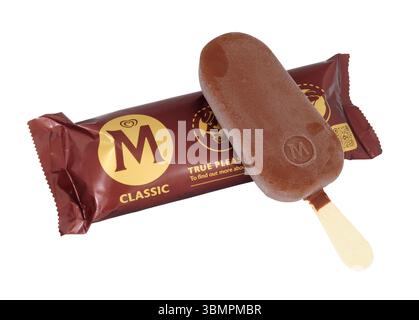 Magnum classic milk chocolate coated Madagascan vanilla ice cream on a wooden stick Stock Photo