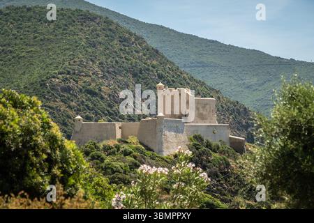 The recently renovated Genoese tower and fortress at Girolata, a small fishing village on the west coast of the mediteranean island of Corsica, only r Stock Photo