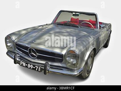 Classic Mercedes-Benz 280 SL parked, showing its iconic design and red leather interior Stock Photo
