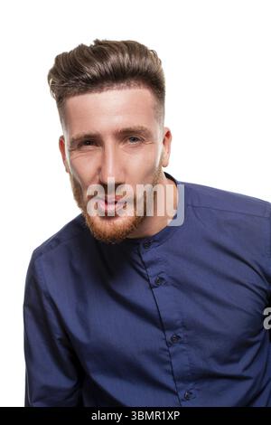 Attractive young bearded man wearing blue shirt is grining, isolated over a white background Stock Photo
